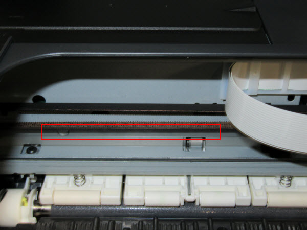 Figure: View of the inside of the printer, encoder strip outlined in red