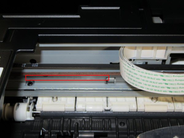 Figure: View of the inside of the printer, encoder strip outlined in red