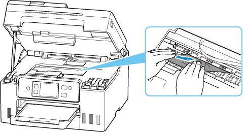 Hold jammed paper firmly with both hands