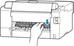Insert the transport unit cover slowly all the way into printer and take down the transport unit cover