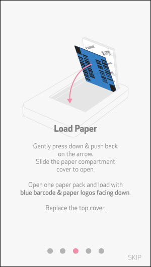 Load Paper: Gently press down and push back on the (up) arrow. Slide the paper compartment cover to open. Open one paper pack and load with the blue barcode facing down. Replace the top cover.