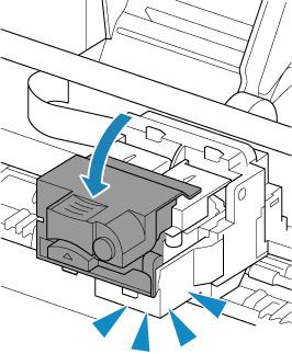 Push down the print head locking cover until it clicks into place