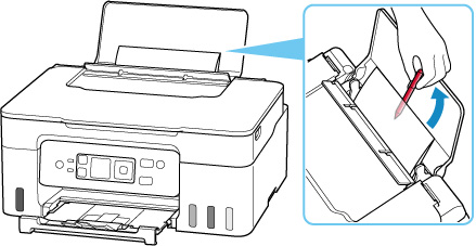 Reach between the paper and rear tray to remove any foreign objects