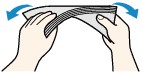 Two hands shown uncurling envelope