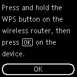 After pressing and holding the WPS button on the wireless router, press OK on the printer