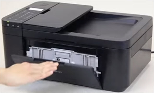 Figure: Front cover of printer being opened