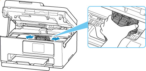 Hold the ink cartridge holder and slide it slowly to the far right or left
