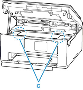 Is there any paper left in the left and right empty spaces (D) in the printer?