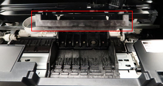 Print head lock lever in raised position