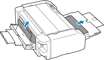 Slowly pull out the paper, either from the paper output slot or from the manual feed tray, whichever is easier