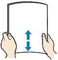 Image shows paper being bent in the opposite direction of the curve