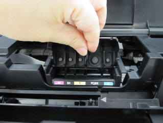 Replacement print head shown being put in place